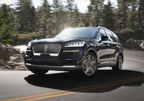 A Lincoln Aviator® SUV is being driven on a winding mountain road | West Point Lincoln in Houston TX
