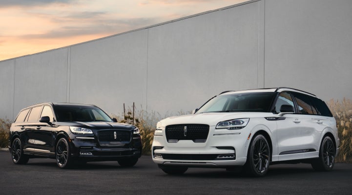 Two Lincoln Aviator® SUVs are shown with the available Jet Appearance Package | West Point Lincoln in Houston TX