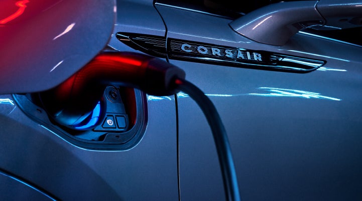 A charger plugged into the charging port of a 2024 Lincoln Corsair® Plug-in Hybrid model. | West Point Lincoln in Houston TX